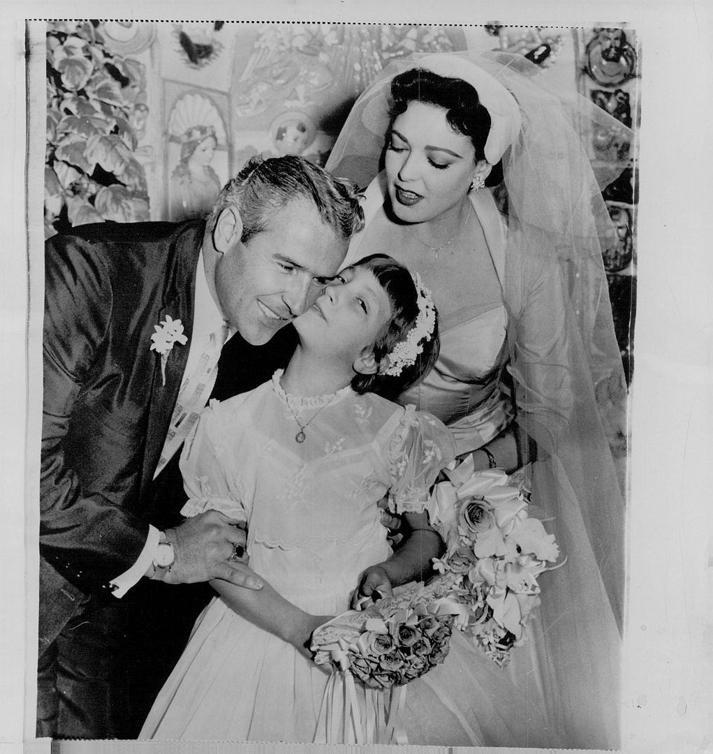 1957 Linda Darnell Daughter kiss stepfather Merele Robertson Wire Photo